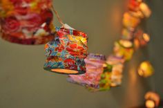 colorful lights hanging from the ceiling in a room with many different colors and patterns on them