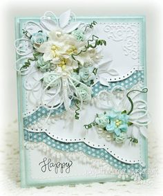 a close up of a greeting card with flowers and pearls on the bottom, along with an embellishment that says happy