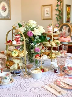 a table topped with plates and cups filled with food