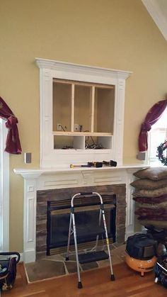 a living room filled with furniture and a fire place