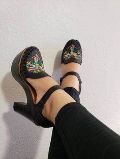 The beautiful otomi embroidery design is unique. Made in Mexico Material: Leather Heel material: synthetic insole Heel height: 4.4 inches Huaraches are not made in half sizes, The reason is they're made out of leather and will stretch out and mold your feet. Ex: If you are size 8.5 I recommend you to order a size 8, if you order a size 9 they may fit you lose, 8 will fit snug but once you break them in they'll mold to your feet. This is a handmade product, they might have small details. Natural Mexican Wedges, Mexican Shoes, Otomi Embroidery, Heel Wedges, Mexican Sandals, Shoe Shopping, Huarache Sandals, Womens Pumps, Funky Jewelry