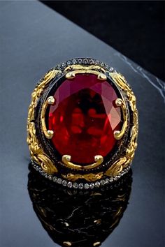 Luxury Handmade Ruby Ring, Ceremonial Red Gemstone Ring, Red Gemstone Rings For Ceremonial Occasion, Red Gemstone Ring For Ceremonial Occasions, Luxury Formal Ruby Ring With Stone Setting, Luxury Ruby Ring With Stone Setting For Formal Events, Luxury Ruby Ring With Stone Setting For Formal Occasions, Luxury Ruby Rings With Intricate Design, Luxury Red Oval Rings