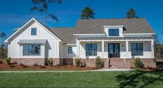 a white house with brick and stone accents