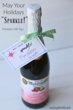 a bottle of wine with a label on it that says, may your holidays sparkle printable gift tags