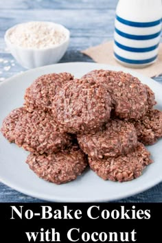 no - bake cookies with coconut on a white plate next to a bottle of milk