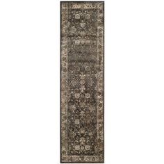 a long rug with an ornate design on the bottom and sides, in grey tones