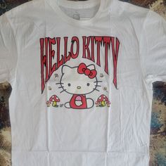 Unisex Hello Kitty By Sanrio White Graphic Tee Shirt With Mushrooms And Bees Nwt. We Have A Bunch Of Hello Kitty In Our Closet So Bundle Up For A Deal Hello! Welcome To This4that. I Do My Best To Accurately Describe Each Item. There Are Times That I May Miss Something. I Assure You That It Is Not Intentional. If You Have Any Questions, Please Message Me. If You Have Problems After Purchase, Please Contact Me Immediately Before Leaving Neutral Or Negative Feedback. Items Come From A Non-Smoking H Hello Kitty Print Fun T-shirt For Spring, White Short Sleeve Hello Kitty T-shirt, White Fitted Kawaii T-shirt, Cute Printed White Shirt, Fitted White Kawaii T-shirt, Fun Hello Kitty Print Summer T-shirt, Cute Hello Kitty Tops For Streetwear, Hello Kitty Summer Tops, Hello Kitty Summer Fun Tops