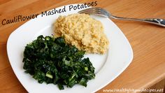 a white plate topped with mashed potatoes and greens