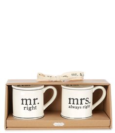 two coffee mugs with mr and mrs written on them in a cardboard gift box