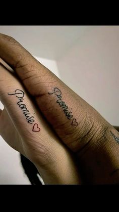 two people with matching tattoos on their hands