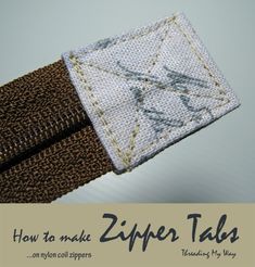 a close up of a piece of cloth with the words how to make zipper tags on it