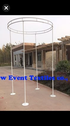 an outdoor event tent with white poles