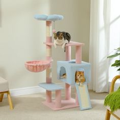 two cats sitting on top of a cat tree in a living room next to a chair