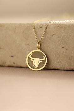 Gold Taurus Zodiac Pendant - Taurus Zodiac Necklace ● Material of pendant: Solid Gold 14k ( REAL GOLD ) ● Metal Stamp: 14k ( REAL GOLD ) ● The pendant is available in 5 sizes: - 12,7 mm / 0.5 inches (Diameter) - 14,0 mm / 0,55 inches ( Diameter ) In the photos - 15,3 mm / 0.6 inches ( Diameter ) - 16,5 mm / 0,65 inches ( Diameter ) - 19,1 mm / 0,75 inches ( Diameter ) ( In the photos the size is 14mm / 0.55 inches Diameter ) ( Jump Ring inner diameter: 4 mm ) ● Material of chain: Solid gold 14k Grad Necklace, Bull Pendant, Taurus Jewelry, Taurus Bull, Locket Design, Taurus Sign, Bull Head, Gold Pendant Jewelry