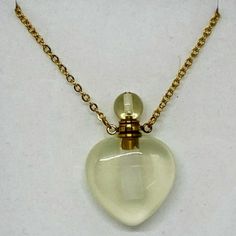 Crystal Perfume Necklace - Citrine Heart Gold Tone Chain This Genuine Gemstone Citrine Heart Shaped Aroma Diffuser Necklace 1" Stone. 21" Stainless Steel Chain, 2' Extender, Lobster Clasp Closure. Comes Gift Boxed With Doppler. Add Essential Oil, Perfume, Moon Water. Perfume Necklace Pendants, Goddess Crystals, Perfume Necklace, Ethereal Jewelry, Moon Water, Bead Diy, Crystal Goddess, Oil Perfume, Diffuser Necklace