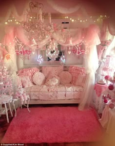 a living room filled with furniture and pink rugs on top of a red carpet