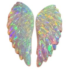 This 4.92 Ct natural Australian gem crystal opal, carved into a pair of angel wings, is a truly exceptional addition to any collection, mined by Sue Cooper herself. Its rarity, coupled with the amazing winged carving, captivates connoisseurs with its rainbow colours. Mined at Sue’s Russells opal mine in western Queensland, Australia, in 2023, this opal gem is a remarkable find. What distinguishes it is its origin: formed within a void, likely left by a decaying tree branch or root, it underwent Ali D'angelo, Jelly Mould, Crystal Angels, Rainbow Colours, Crystal Opal, Queensland Australia, Opal Crystal, Rarity, Queensland