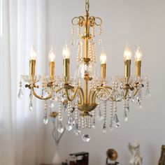 a chandelier hanging from the ceiling in a room