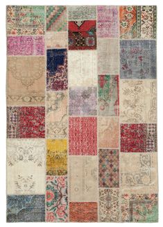 multicolored patchwork rug with many different colors and patterns on it, all in squares