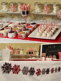 a table topped with lots of desserts and candy canes on top of white plates