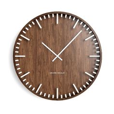 a wooden clock with white numbers on it