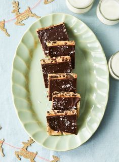 pieces of chocolate peanut butter bars on a plate