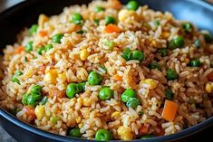 a bowl filled with rice and peas on top of a table