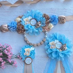 some blue flowers and ribbons on a table