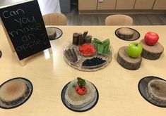 a table topped with plates and bowls filled with different types of food next to a sign that says can you make apple?