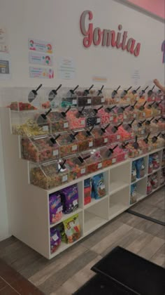 there is a display in the store filled with sweets