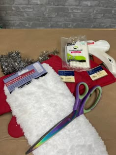 scissors, tinsel, and other items laid out on a table