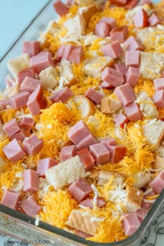 a casserole dish with ham, cheese and bread in it is ready to be eaten