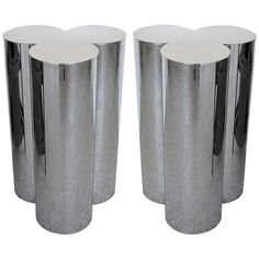 three stainless steel vases with hearts on them