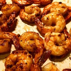 grilled shrimp on a baking sheet ready to be cooked in the oven for dinner