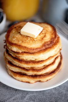 a stack of pancakes with butter on top