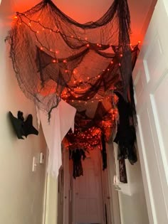 a hallway decorated with halloween decorations and lights