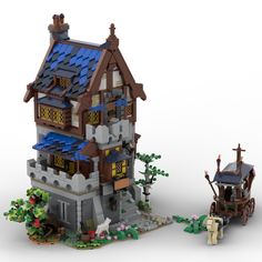 a lego model of a house with a horse drawn carriage in front of it,