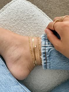 Dainty 14k gold filled anklet If you would like a different length that is not listed, please contact us for a custom order! Finding Your Size We recommend using a flexible measuring tape to wrap around your ankle to find the length of your preferred fit. An alternative to this is getting a piece of string or shoelace, wrap that around your ankle, and measure the length in inches If you will be layering your anklets, be sure to plan ahead and get a slightly smaller or bigger size, depending on h Feet Jewellery, Ankle Jewelry, Herringbone Chain, Gold Anklet, Jewelry Workshop, Dope Jewelry, Classy Jewelry, Jewelry Essentials, Stacked Jewelry