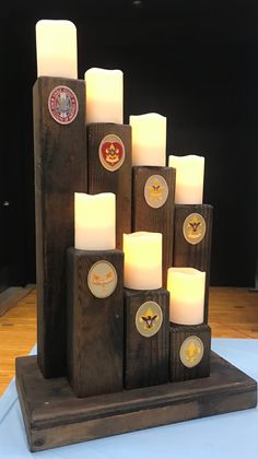 candles are arranged on top of wooden blocks