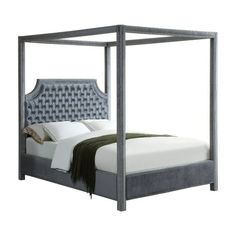 a bed with an upholstered headboard and foot board is shown in this image