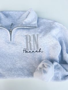 a light blue sweatshirt with the name hannah on it and an embroidered hoodie underneath