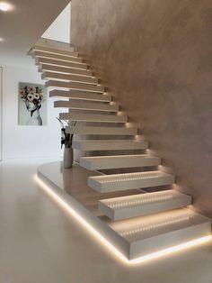 the stairs are lit up with leds to create an interesting effect in this room