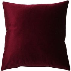 a red velvet pillow on a white background