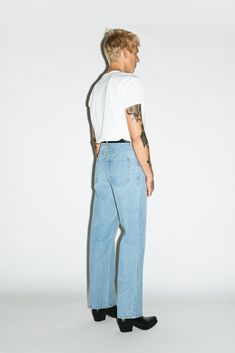 A classic pair of straight-leg jeans inspired by the off-duty uniform of 90's runway models. Designed to pinch just above the hips, the high-rise and roomy straight-leg elongates the leg for a rugged, boyish cut. Constructed in a rigid, non-stretch denim, these go-to jeans only gets better with age. Mens High Rise Jeans, Straight Leg Denim Jeans, Mens Straight Leg Jeans Outfits, 80s High School Fashion, Jeans Style Man, Straight Leg Jeans Outfits Men, Mens Fashion Photoshoot, Mens Night Out Fashion, Rockstar Style Men