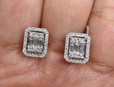 Classy Diamond Earrings Emerald Cut Halo Studs. Nice size earrings you can dress up or down with. Excellent craftsmanship, all diamonds are set smooth. Lays nice on the ear. These square shapes are a bit different than your everyday round ones. The push backings have double notches for a secure fit. Measures 10.1 x 9mm. These natural diamonds are nice and sparkly. Genuine Round, Princess and Baguette Cut Diamonds Total weight: 0.98 Carats Clarity: SI Color: G All white and shiny diamonds, no clo Luxury Rectangular Diamond Earrings In Prong Setting, Luxury Radiant Cut Earrings With Vvs Clarity, Luxury Rectangular Earrings For Anniversary, Luxury Square Cut Diamond Accent Earrings, Luxury Diamond Rectangular Earrings, Classy Diamond Earrings, Diamond Square Earrings, Earrings Gold Diamond, Emerald Cut Earrings Studs