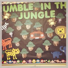 a bulletin board with the words rumble in the jungle and pictures of children's faces