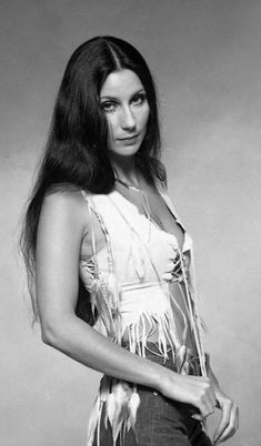 a woman with long hair and fringes posing for a photo