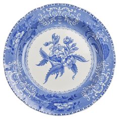 a blue and white plate with flowers on it