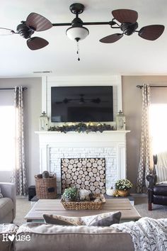 the living room is clean and ready to be used as a tv over the fireplace