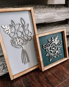 two wooden frames with flowers cut out of them sitting on a wood floor next to each other